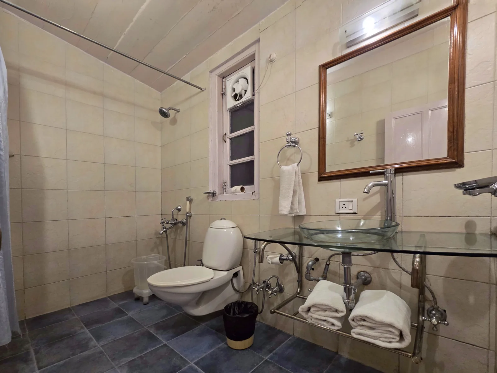 Heritage Classic bathroom with a glass basin, framed mirror and walk-in shower