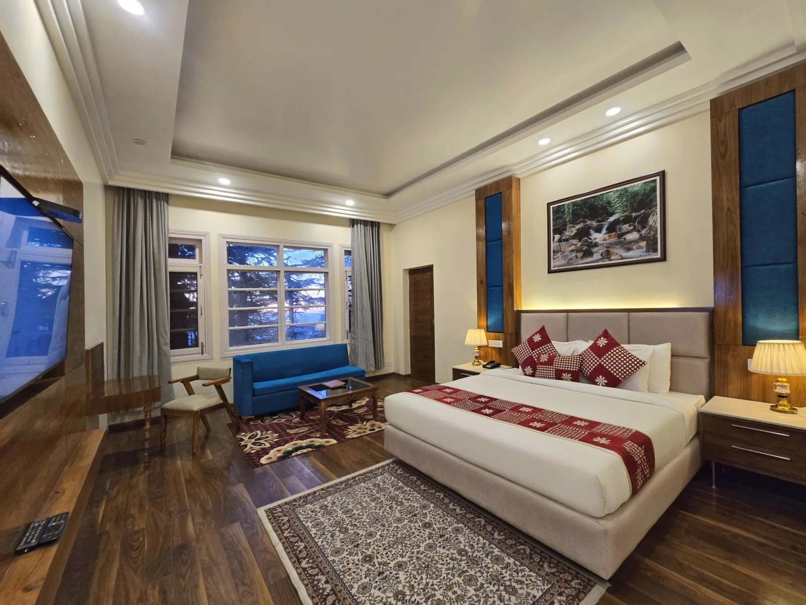 Imperial Room from the window side, with a blue sofa and Persian rug
