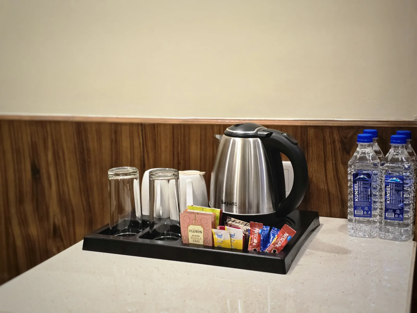 Tea and coffee tray with kettle and bottled water in the Imperial Room