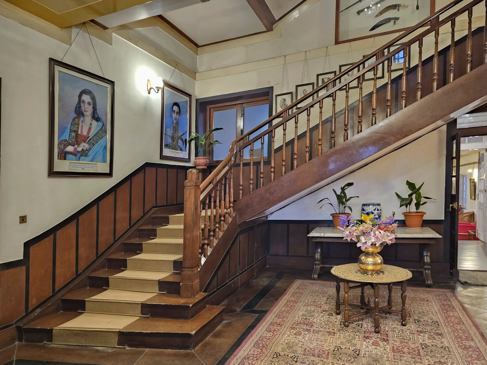 The grand staircase and lobby of Hotel Woodville Palace