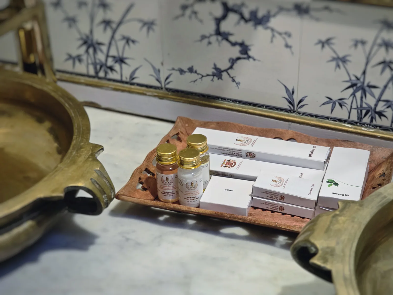 Hand-made toiletries on a brass tray in the Heritage Bollywood Suite bathroom