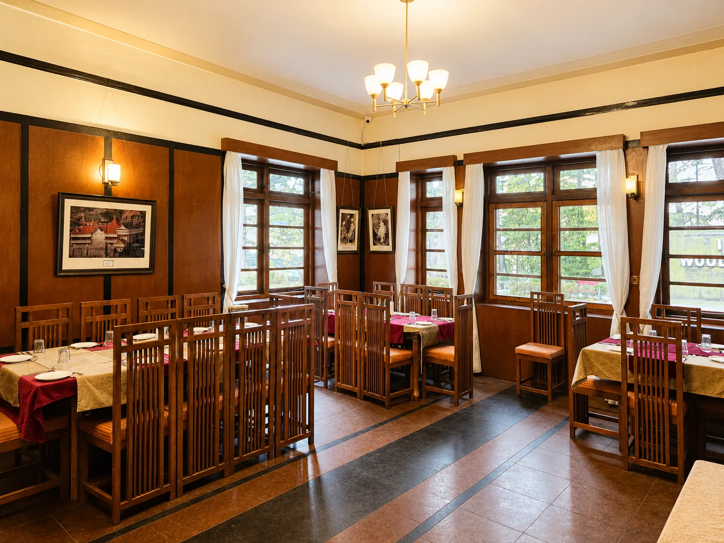 The Hollywood Bar — wood-paneled interiors and framed portraits at Woodville Palace