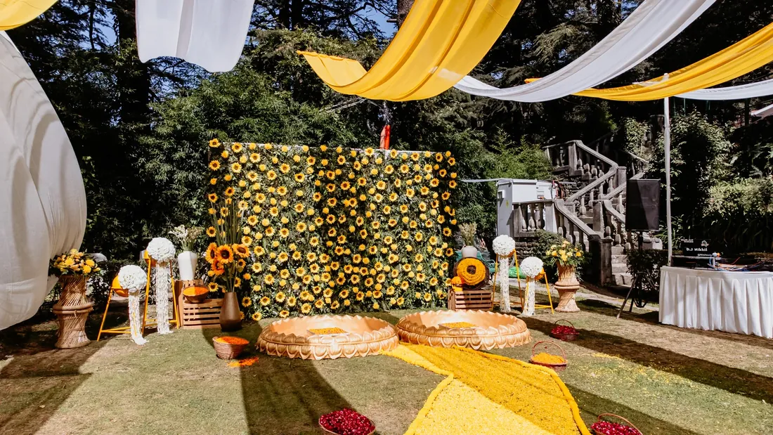 Aerial view of Woodville Palace Shimla during a haldi ceremony — marigold-yellow drapes across the lawn