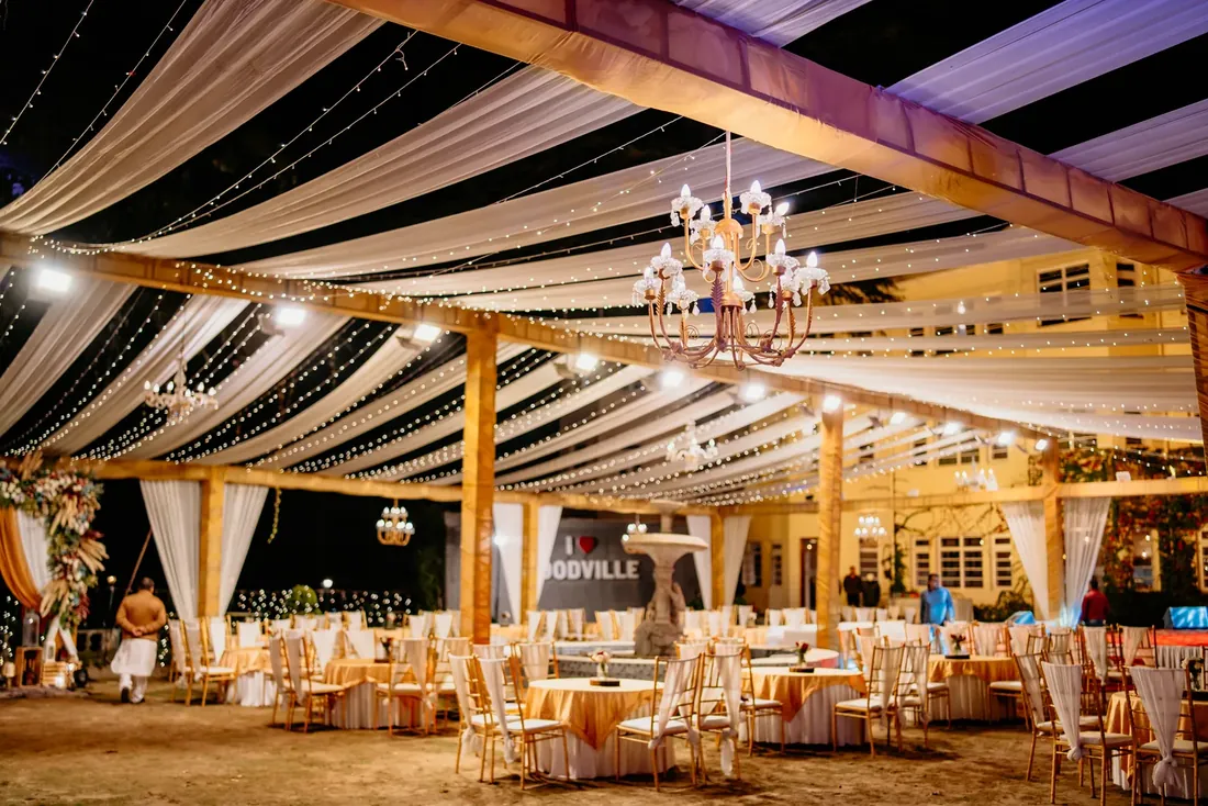 Evening engagement decor at Woodville Palace Shimla — white drapes, fairy lights and gold chiavari chairs