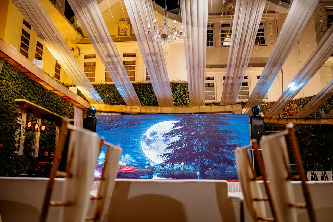 Evening engagement decor at Woodville Palace Shimla — white drapes, fairy lights and gold chiavari chairs