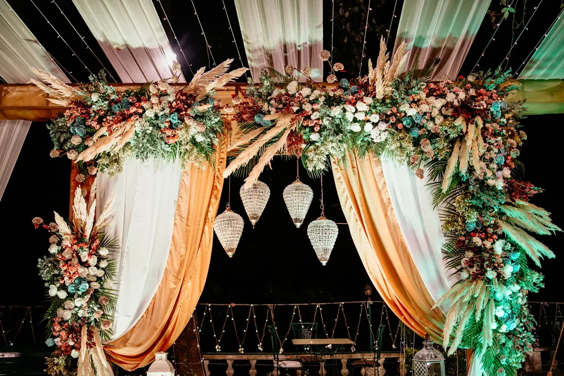 Evening engagement decor at Woodville Palace Shimla — white drapes, fairy lights and gold chiavari chairs