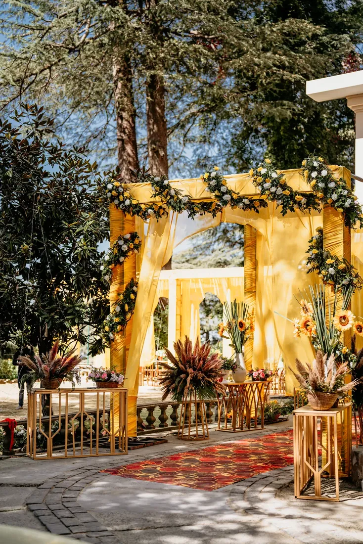 Haldi ceremony decor at Woodville Palace Shimla — sunflowers, marigold and yellow drapes on the palace lawn