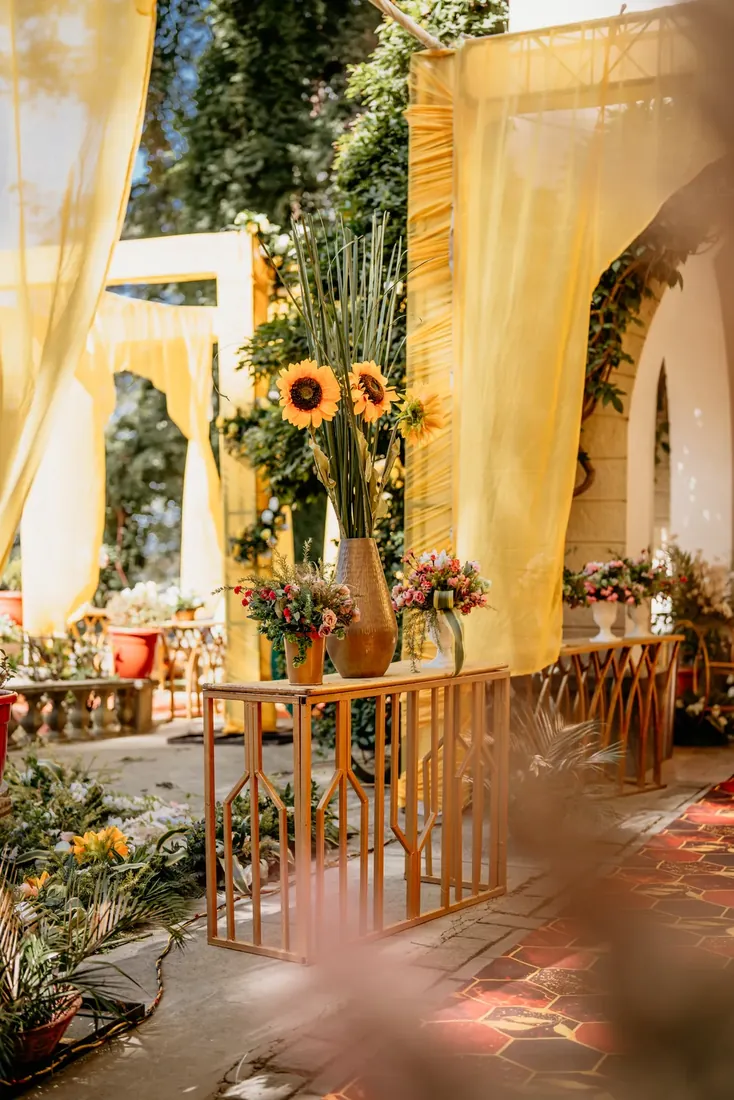 Haldi ceremony decor at Woodville Palace Shimla — sunflowers, marigold and yellow drapes on the palace lawn
