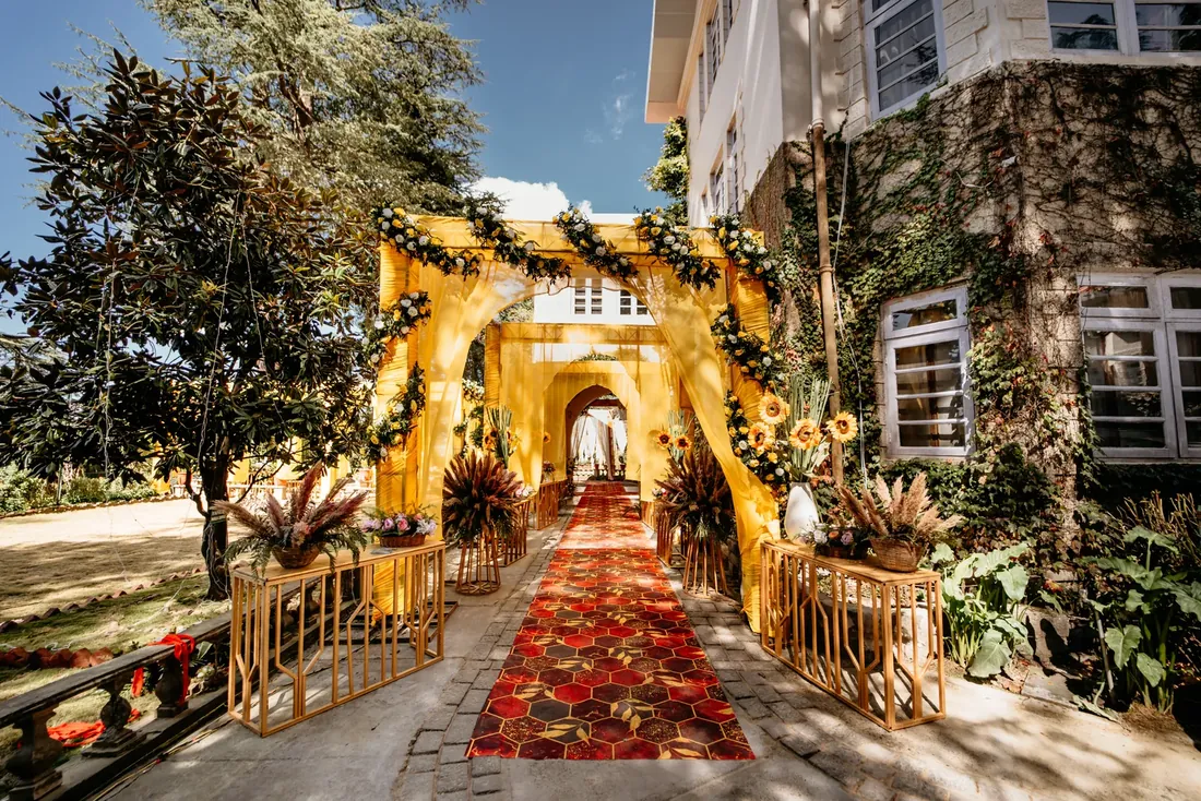 Haldi ceremony decor at Woodville Palace Shimla — sunflowers, marigold and yellow drapes on the palace lawn