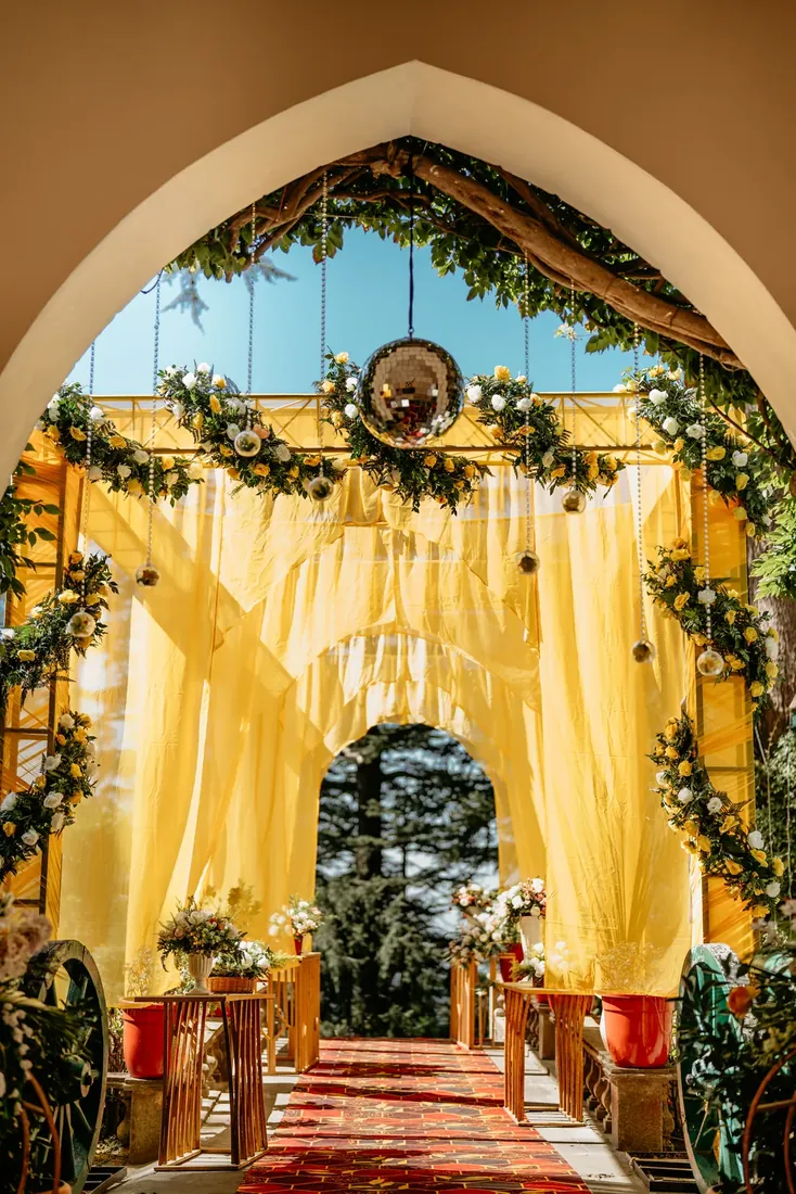 Haldi ceremony decor at Woodville Palace Shimla — sunflowers, marigold and yellow drapes on the palace lawn