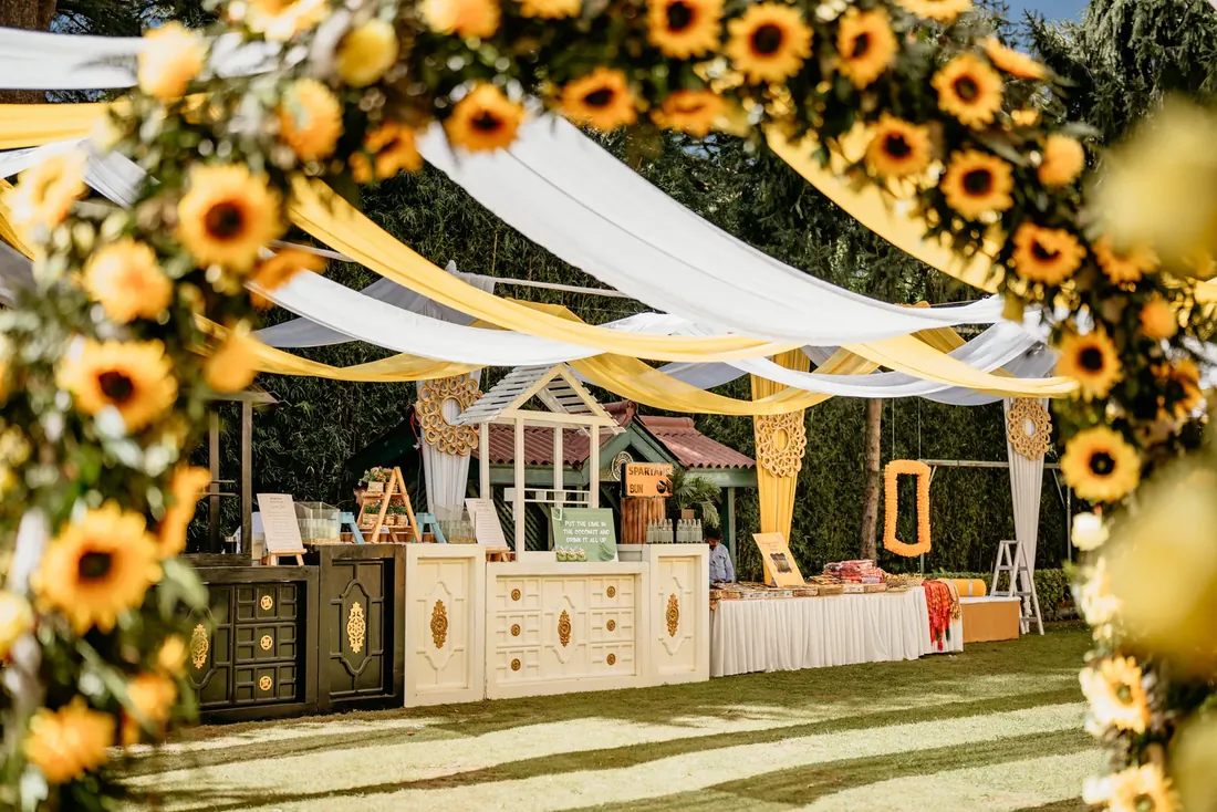 Haldi ceremony decor at Woodville Palace Shimla — sunflowers, marigold and yellow drapes on the palace lawn