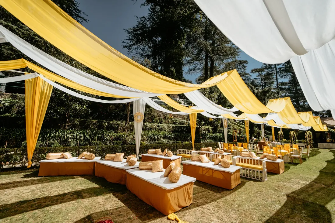 Haldi ceremony decor at Woodville Palace Shimla — sunflowers, marigold and yellow drapes on the palace lawn