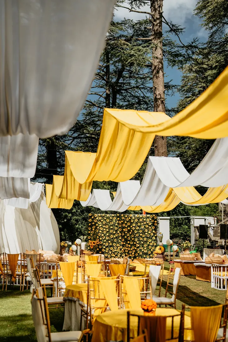 Haldi ceremony decor at Woodville Palace Shimla — sunflowers, marigold and yellow drapes on the palace lawn